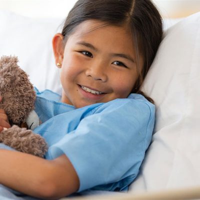 Girl on hospital bed