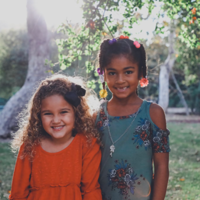Two young girls smiling